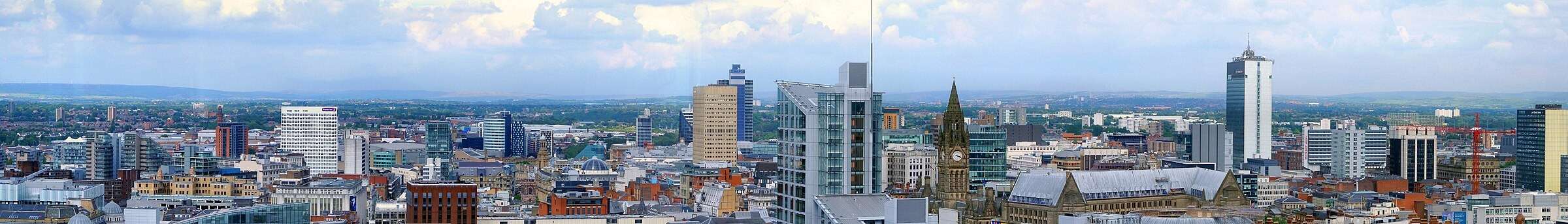 The Manchester skyline with the Town Hall clock tower and the Beetham Tower
